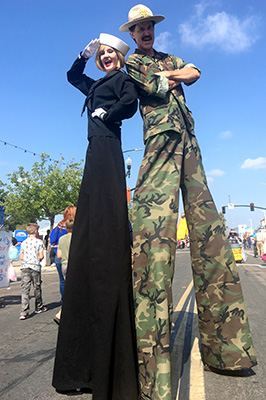Navy and Marine stilt walkers